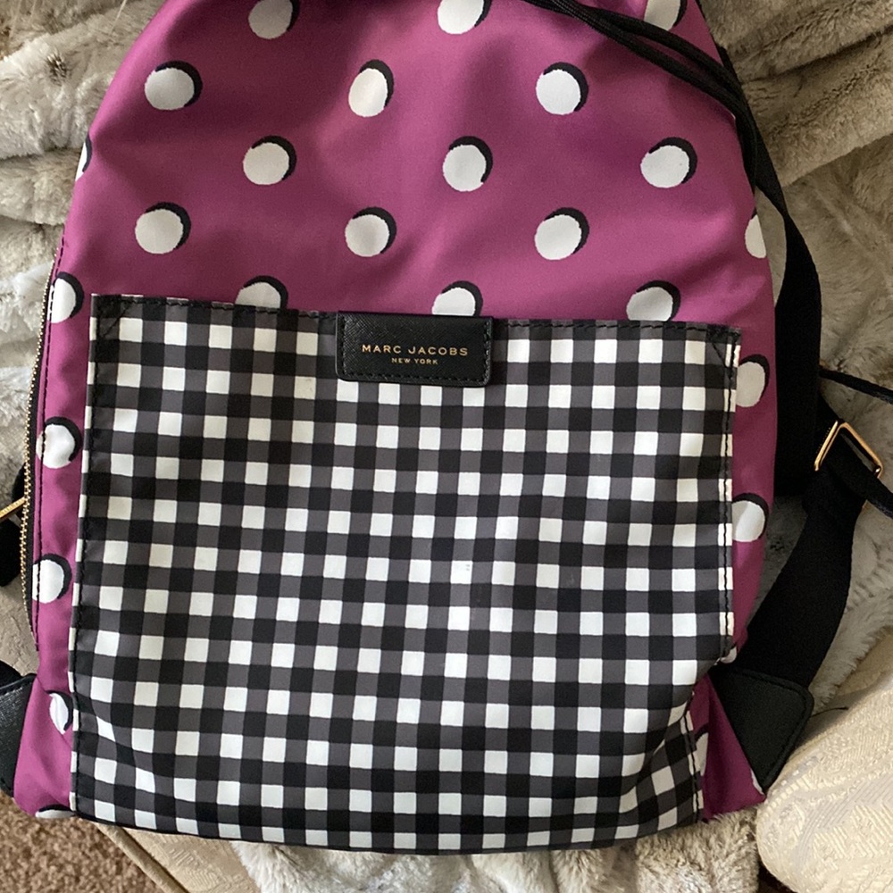 Marc Jacobs draw string multi pattern backpack.